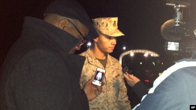 Marine Base Quantico spokesman Lt. Agustin Solivan briefs reporters following a shooting incident on the base, March 22, 2013.