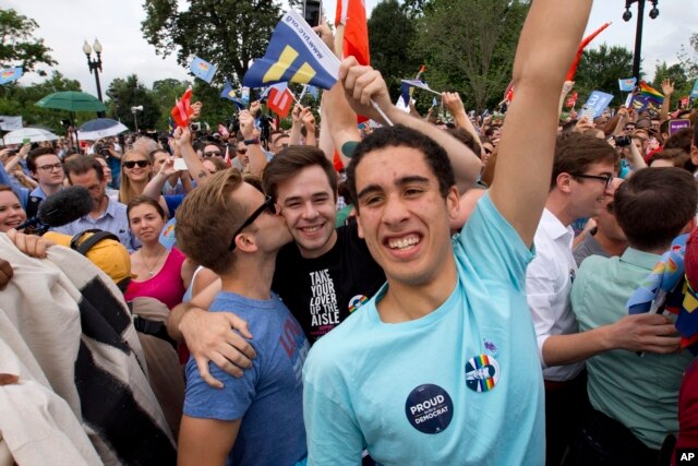Supporters of same-sex marriage celebrate outside of the Supreme Court in Washington, Friday June 26, 2015, after the court declared that same-sex couples have a right to marry anywhere in the US.