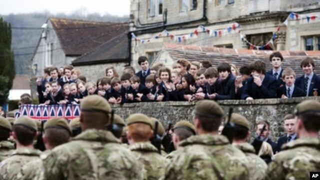 Yorkshire Regiment (3 YORKS) march past during a pre-deployment parade in Warminster, in Wiltshire, March 16, 2012. 