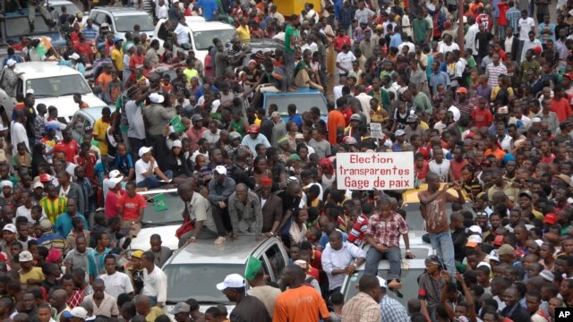 Protesters gather as thousands rally to call for the departure of South African company Waymark, which was hired by the Guinean government to re-do the country's electoral list, in Conakry, Guinea, September 20, 2012.