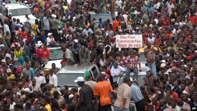 Protesters gather as thousands rally to call for the departure of South African company Waymark, which was hired by the Guinean government to re-do the country's electoral list, in Conakry, Guinea, September 20, 2012.