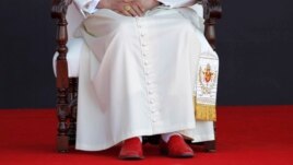 Upon retiring Pope Benedict XVI will lay aside the red "shoes of the fisherman" that have been part of his papal attire, Guanajuato airport, Silao, March 26, 2012.