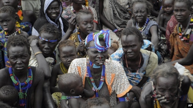 Victims of ethnic violence in Jonglei state, South Sudan, wait in line at the World Food Program distribution center in Pibor to receive emergency food rations, January 12, 2012.