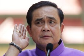 Thailand's Prime Minister Prayuth Chan-ocha listens to a question from a reporter during a press conference at the government house in Bangkok, Thailand, Tuesday, March 31, 2015.