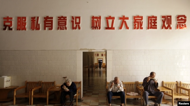 Elderly residents eat their lunch at a nursing home in Henan province, China.