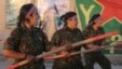 FILE - Kurdish female fighters of the Women's Protection Unit (YPJ) participate in training at a military camp in Ras al-Ain city in Syria's Hasakah province June 30, 2014.