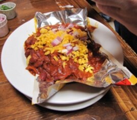 Somewhere, buried beneath the glop are the Fritos in this Frito Pie.