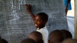 A young Congolese boy at the Mugosi Primary School, which caters mostly for children of the Kahe refugee camp in the town of Kitschoro, in the north eastern part of the Democratic Republic of the Congo. (UNESCO/M.Hofer)