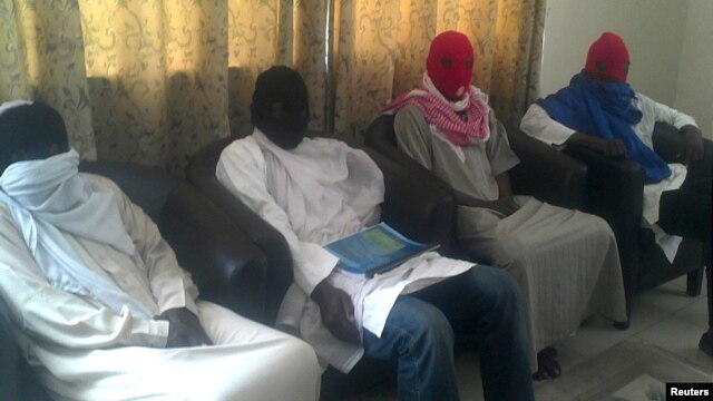 In video, captive says group was abducted by Islamist sect Boko Haram, members of whom are seen below, Maiduguri, Nigeria, Feb. 23, 2013.