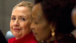  Clinton looks toward South Africa's Foreign Minister Maite Nkoana-Mashabane, during the US-South Africa Business Partnership Summit in Pretoria, South Africa, Tuesday, Aug. 7, 2012.