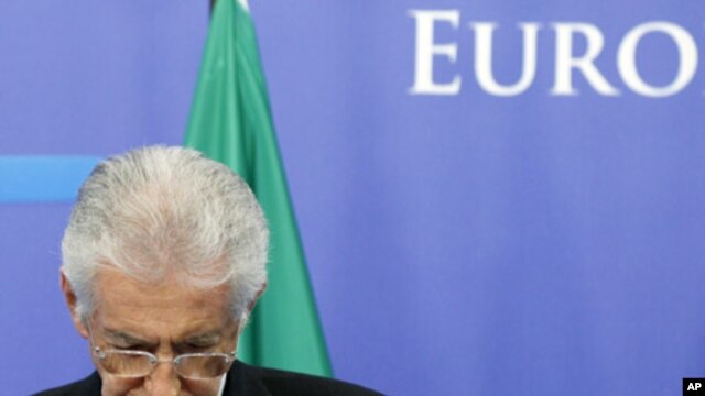 Italy's Prime Minister Mario Monti addresses a news conference at the EU Council in Brussels, November 22, 2011.