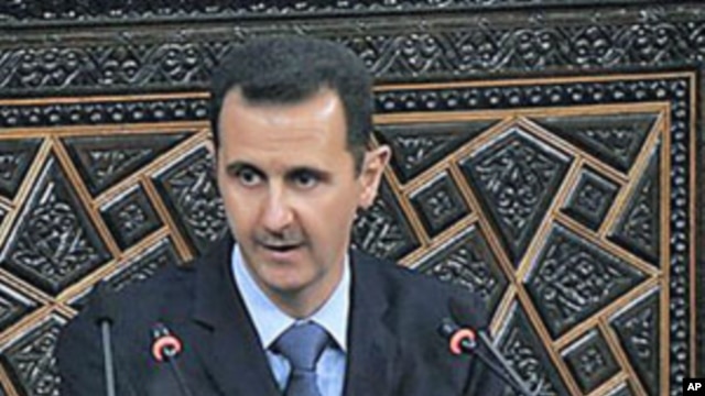 Syrian President Bashar al-Assad addresses the nation during a speech in Damascus, Syria