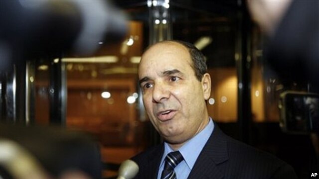 Ibrahim Dabbashi, Libya's deputy ambassador at the United Nations, speaks to reporters at the entrance to the Libyan Mission in New York February 21, 2011