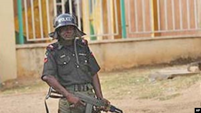 A policeman stands guard in Kaduna, Nigeria, April 21, 2011
