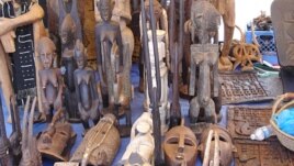 West African masks are displayed by Moses Camara at Eastern Market, in Washington D.C.. (file) (VOA/Elizabeth Monnac)     