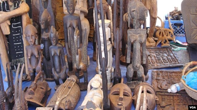 West African masks are displayed by Moses Camara at Eastern Market, in Washington D.C.. (file) (VOA/Elizabeth Monnac)     