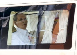 Thailand's King Bhumibol Adulyadej sits in a vehicle as he leaves Siriraj Hospital for the Grand Palace to join a ceremony marking Coronation Day in Bangkok, Thailand, May 5, 2015.