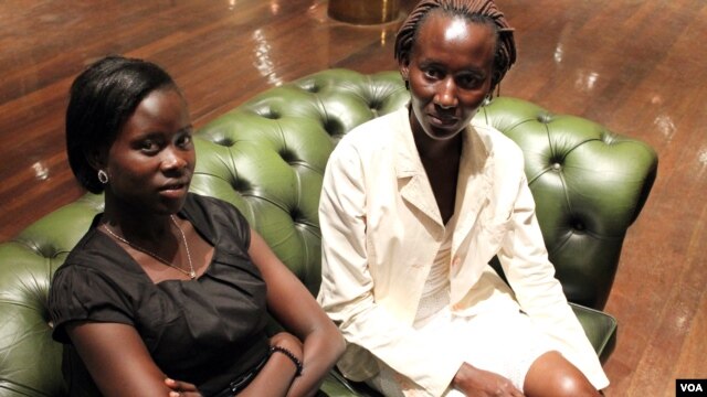 19 year-old Proscovia Alengot Oromait (left), Africa's youngest MP, with her sister in Kampala on September 21. (Hilary Heuler/VOA News)