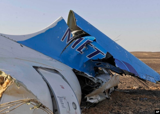 The tail of a Metrojet plane that crashed in Hassana, Egypt on Saturday, Oct. 31, 2015.