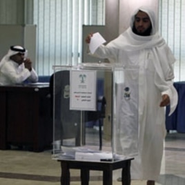 A man casts his ballot at a polling station at Prince Salman center in Riyadh September 29, 2011