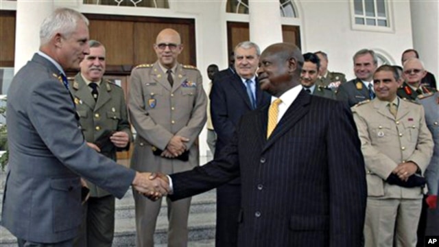 Uganda President Yoweri Museveni, right, greets European Union Military Committee Army Officers after a security meeting where they committed to support pacification of Somalia, at State House, Entebbe, Uganda, 04 Oct. 2010