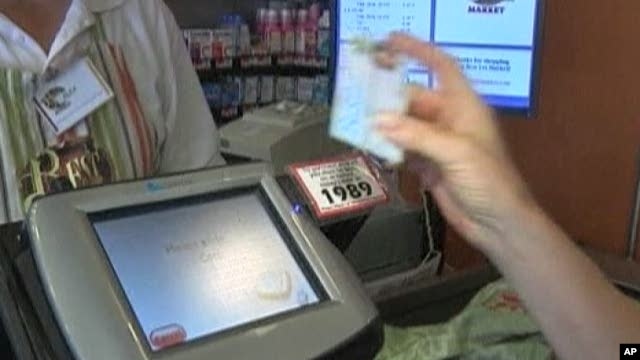 Food stamp recipient pays for groceries in New York