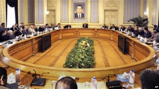 A general view of Egyptian Vice President Omar Suleiman, center back, meeting with leaders of Egyptian parties and the Muslim brotherhood leadership in Cairo, Egypt, Sunday, Feb. 6, 2011