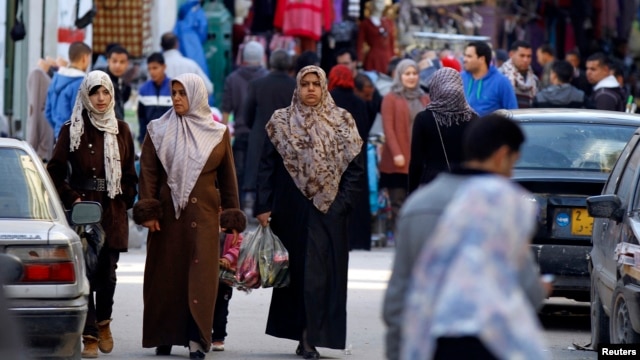 FILE - Women shop in the souq (market) of the old city in Tripoli, February 13, 2012. 