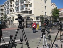 Plain clothes agents guard the front of the residential Beijing compound where Liu Xia lives. She is the wife of the newest Nobel Peace Laureate, jailed dissident Liu Xiaobo. She is reportedly inside, but under house arrest.
