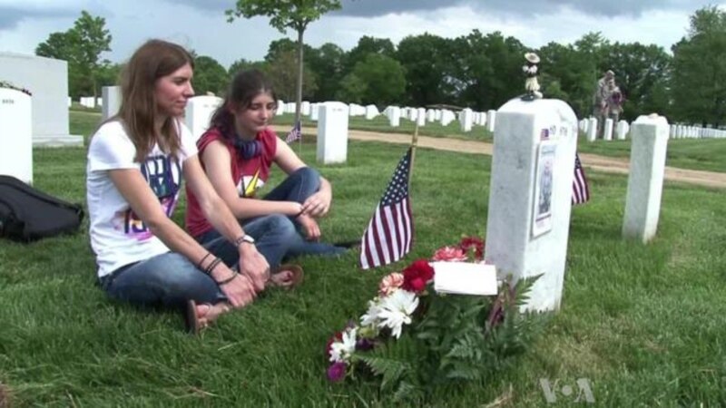 Soldiers Place US Flags in Arlington Cemetery for Memorial Day