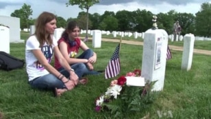 Soldiers Place US Flags in Arlington Cemetery for Memorial Day
