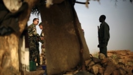 French soldiers and their Malian counterparts at an observation post outside Sevare, some 620 kms (400 miles) north of Bamako, Jan. 24, 2013.  