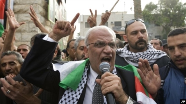 Palestinian chief peace negotiator Saeb Erakat takes part in a demonstration against the Al-Jazeera satellite channel in the West Bank city of Jericho, January 25, 2011