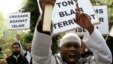 Michael Adebolajo, front, shouts slogans as Muslims march in London in a protest against the arrest of six people in anti-terror raids, April 2007.
