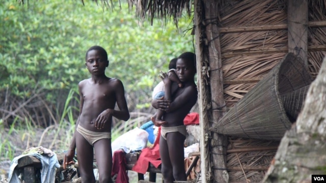 In fishing villages along the creeks in the Niger Delta, locals say children are constantly sick from drinking water polluted by oil. (Heather Murdock for VOA)