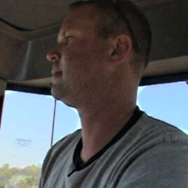 Virginia farmer Brad Eustace uses a GPS-guided tractor to til his fields.