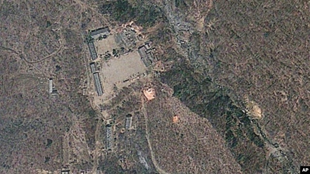 Satellite image provided by GeoEye appears to show a train of mining carts, at the lower center of the frame, and other preparations underway at North Korea's Punggye-ri nuclear test site but no indication of when a detonation might take place, April 18, 