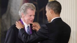 President Barack Obama presents a 2010 National Medal of Arts to pianist Van Cliburn, March 2, 2011, during a ceremony in the East Room of the White House in Washington.