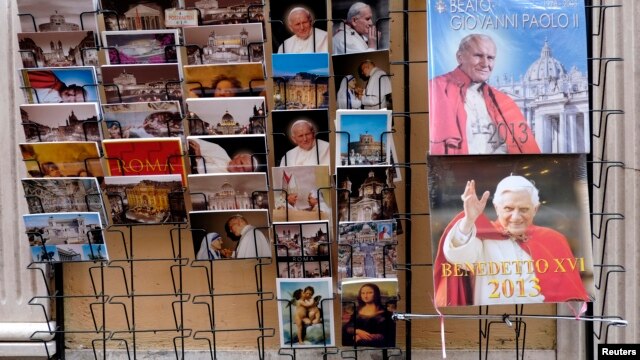 Postcards and calendars are displayed outside a shop at the Vatican, February 12, 2013.