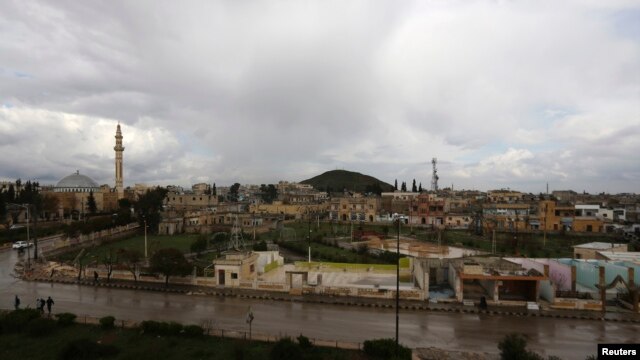 FILE - A general view shows the town of Azaz, near the Syrian-Turkish border, March 11, 2014. 