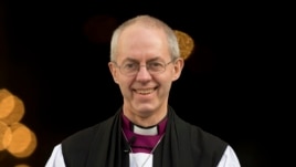 The new Archbishop of Canterbury, Justin Welby, walks outside St Paul's Cathedral as he poses for the media following his ceremony known as the confirmation of election in London, February 4, 2013.