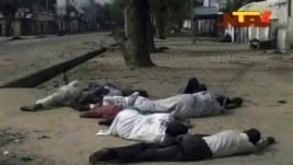 According to The Associated Press, Nigerian officials dumped dozens of corpses in front of a hospital after soldiers opened fire on civilians. Frame grab from TV footage shot by Nigeria's television authority shows people lying down (condition unknown) on a street in Maiduguri, Oct. 8, 2012.