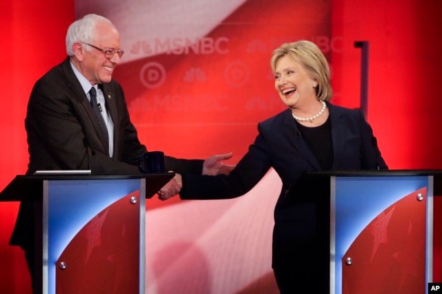 Democratic presidential candidates Senator Bernie Sanders and former Secretary of State Hillary Clinton shake hands during a Democratic presidential primary debate at the University of New Hampshire in Durham, Feb. 4, 2016.