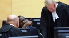 William Ruto (C) sits in the courtroom of the International Criminal Court in The Hague, May 14, 2013.