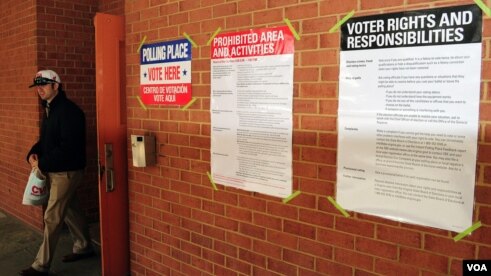 People have been voting across the country all day. Soon, the ballot counting will begin. 

 Posters near polling provide information about voting, Arlington, Virginia, November 6, 2012. (Dimitris Manis/VOA)