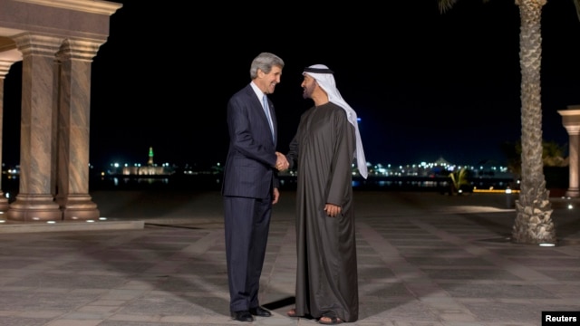 U.S. Secretary of State John Kerry (L) speaks to Abu Dhabi's Crown Prince Sheikh Mohammed bin Zayed al-Nahyan before their meeting at the Emirates Palace in Abu Dhabi, March 4, 2013.