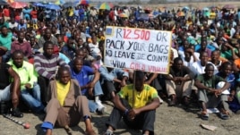 Striking Lonmin Platinum miners gather in Marikana, South Africa, where a new wage offer was rejected, Sept. 14, 2012. 
