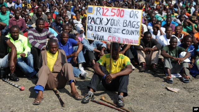 Striking Lonmin Platinum miners gather in Marikana, South Africa, where a new wage offer was rejected, Sept. 14, 2012. 