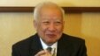 Then Cambodian King Norodom Sihanouk holds a glass during a meeting with Chinese State Councilor Dai Bingguo (not seen) in Beijing, October 30, 2006.