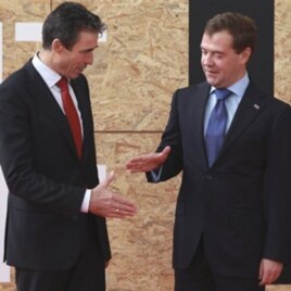 NATO Secretary General Anders Fogh Rasmussen, left, and Russian President Dmitry Medvedev are seen prior to participating in a NATO Russia Council meeting at a NATO summit in Lisbon (file photo)